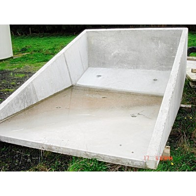 Large trapezoidal precast concrete sand trap on grass