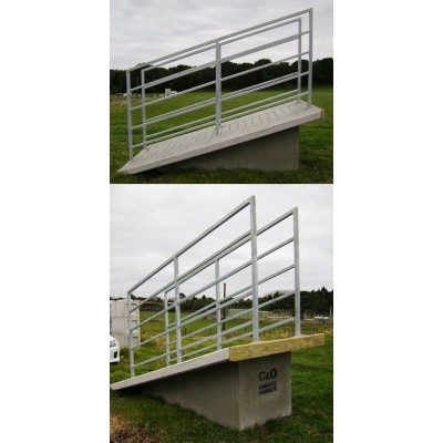 Galvanised concrete stock loading ramp with walkway rails